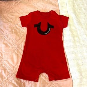 Red baby True Religion Romper.